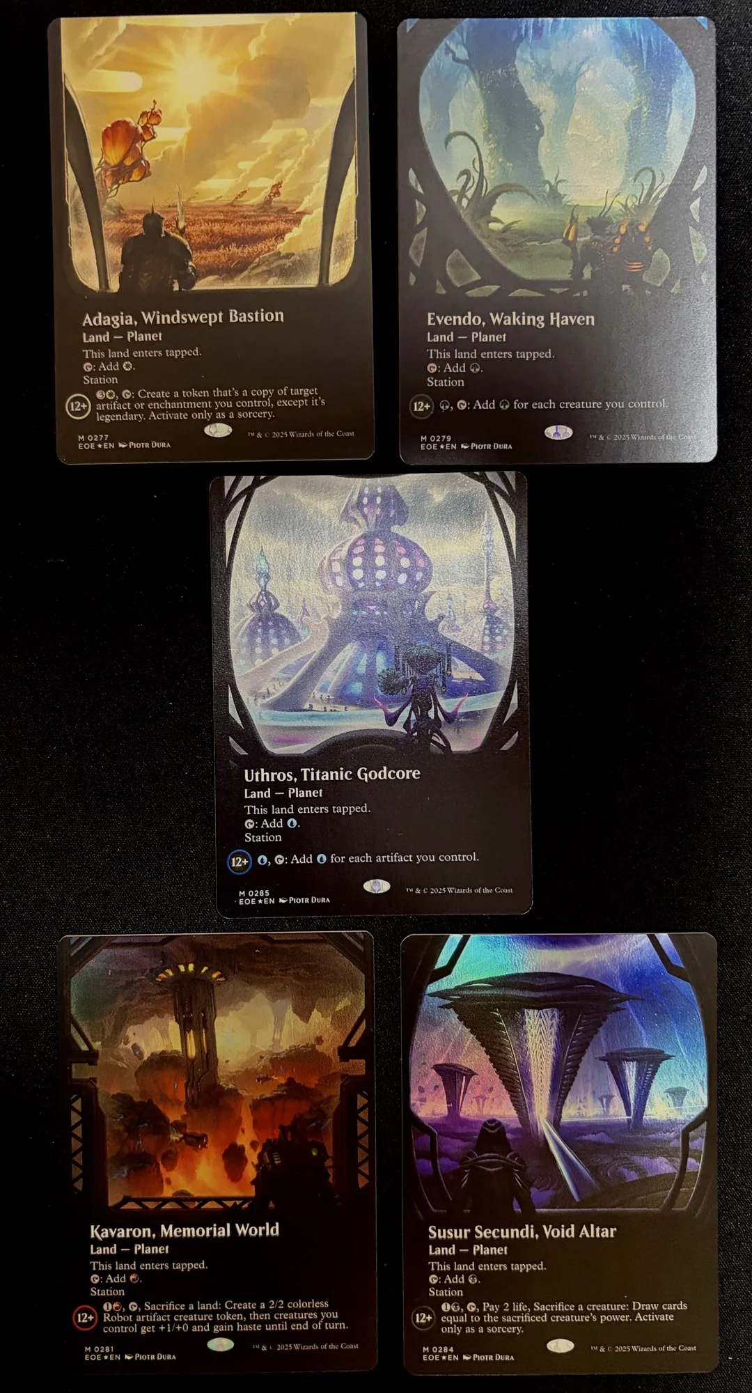 A picture of the 5 currently released MTG Planet cards, extended art foil editions
