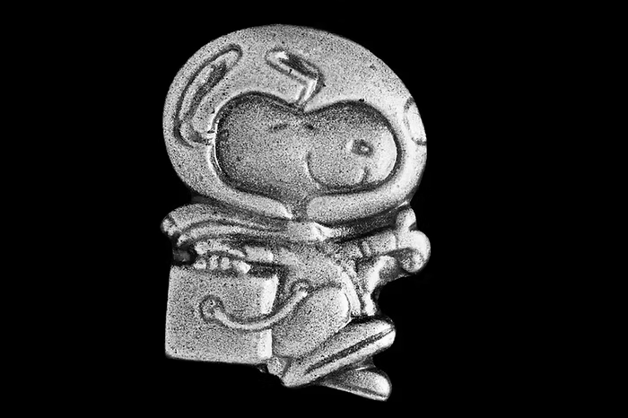 The Silver Snoopy pin, awarded to NASA astronauts and employees for "outstanding achievements related to human flight safety or mission success." Credit: NASA | Marvin Smith