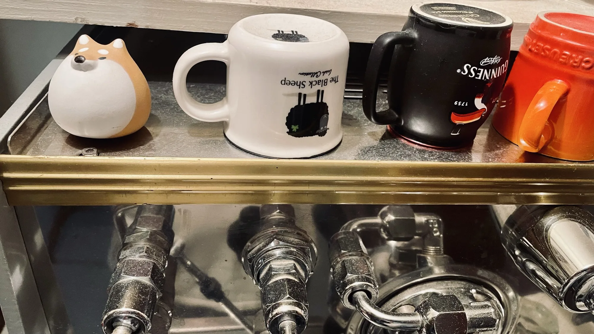 Shiba Inu tea pet on top of my espresso machine