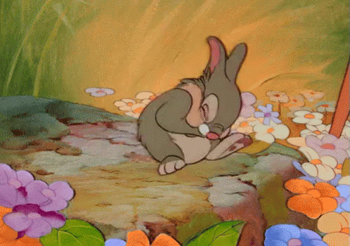 Thumper, the bunny from Disney's Bambi, laughs as he clutches his belly and rolls back and forth on his back.